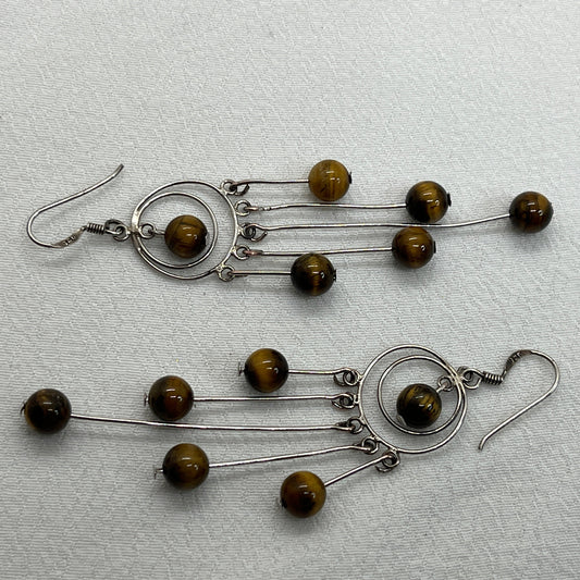 Sølv ørering og masser af Tigerøjne