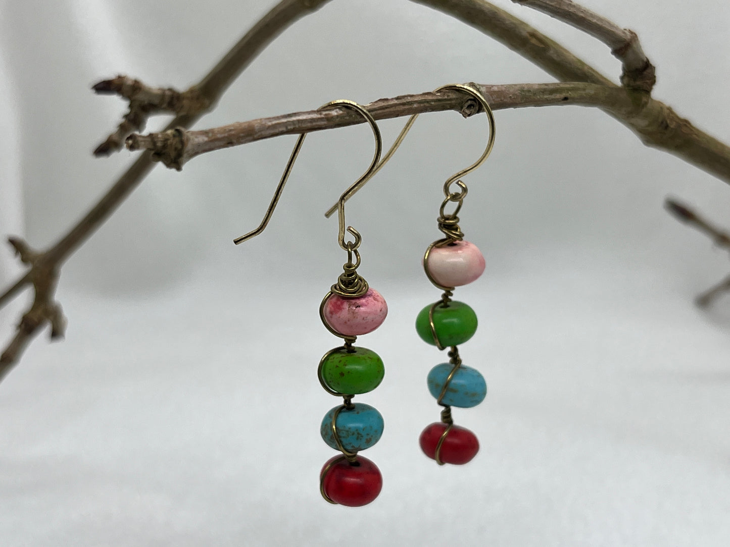 Messing øreringe med 4 på række