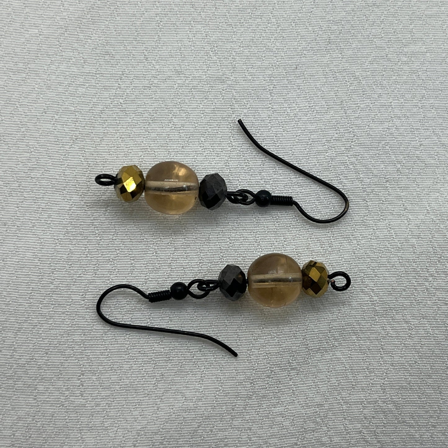 Sorte øreringe med champagne