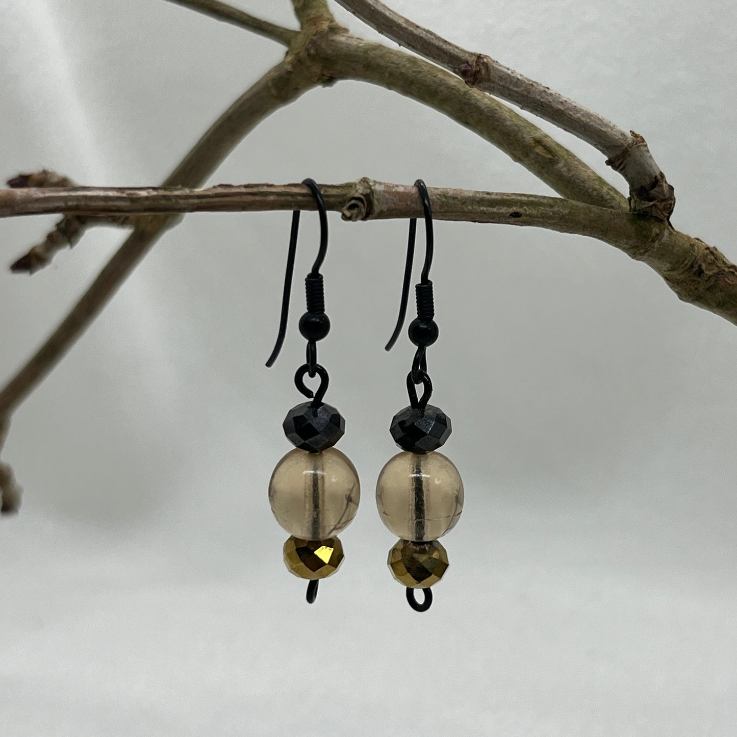 Sorte øreringe med champagne