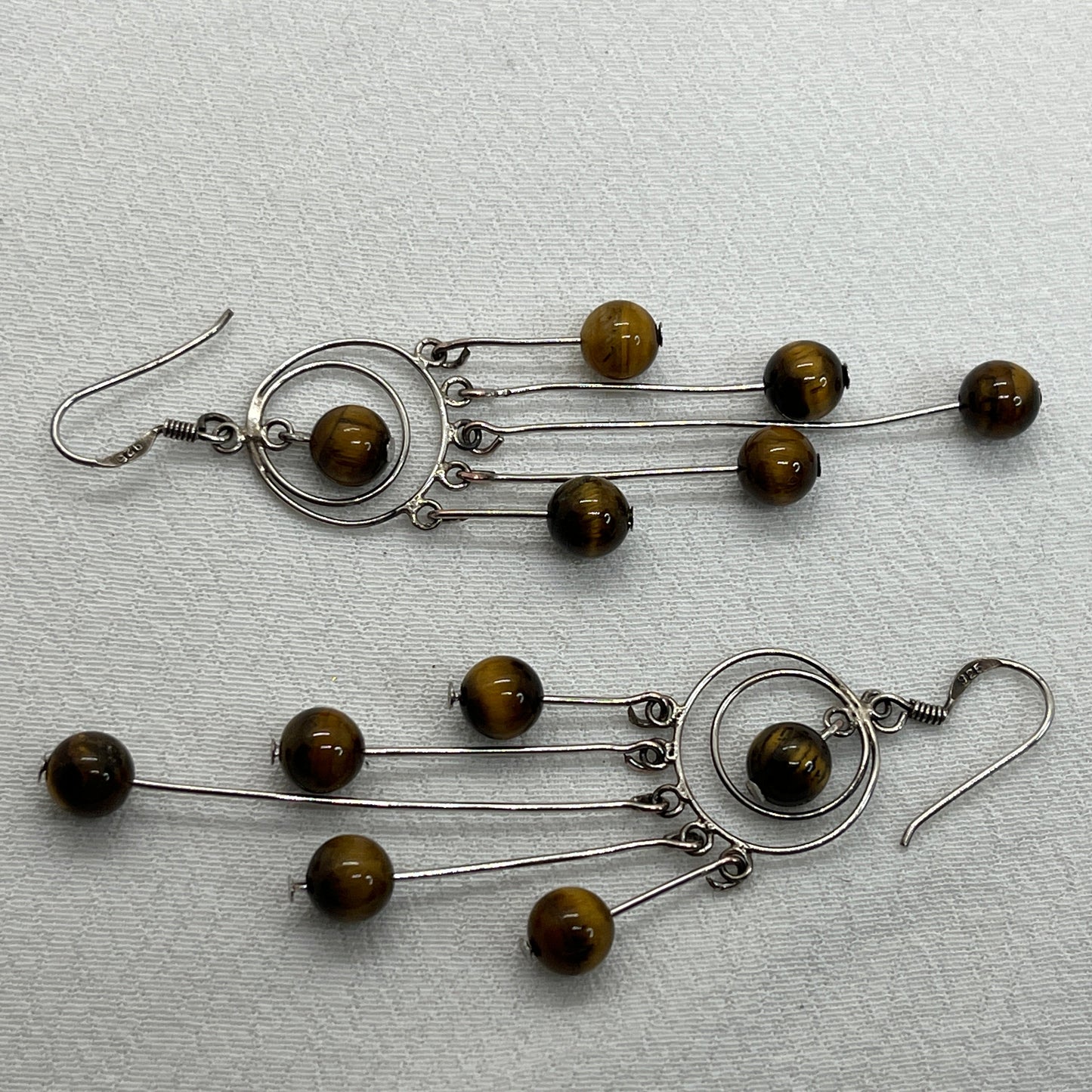 Sølv ørering og masser af Tigerøjne