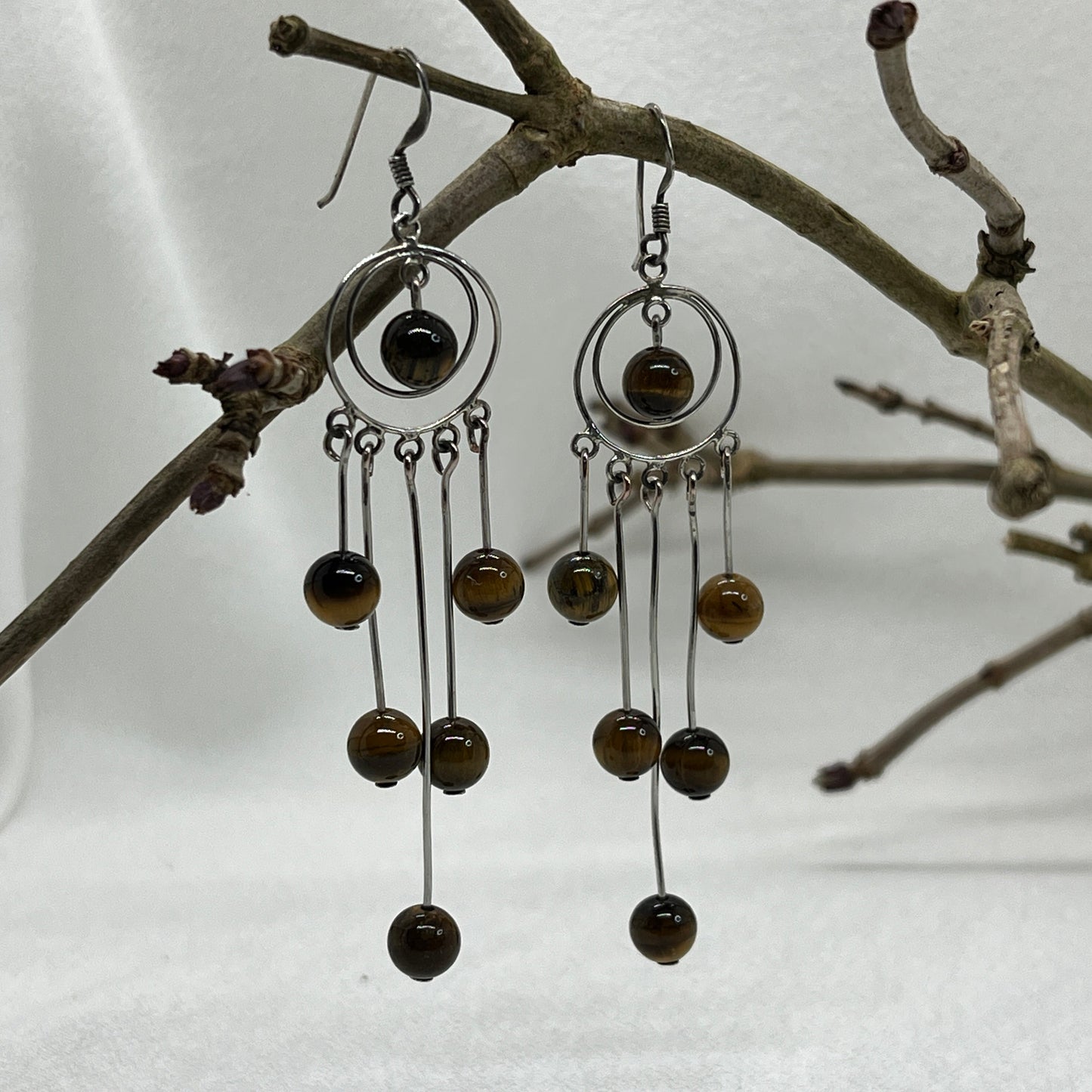 Sølv ørering og masser af Tigerøjne