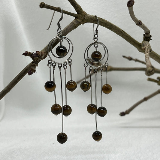 Sølv ørering og masser af Tigerøjne