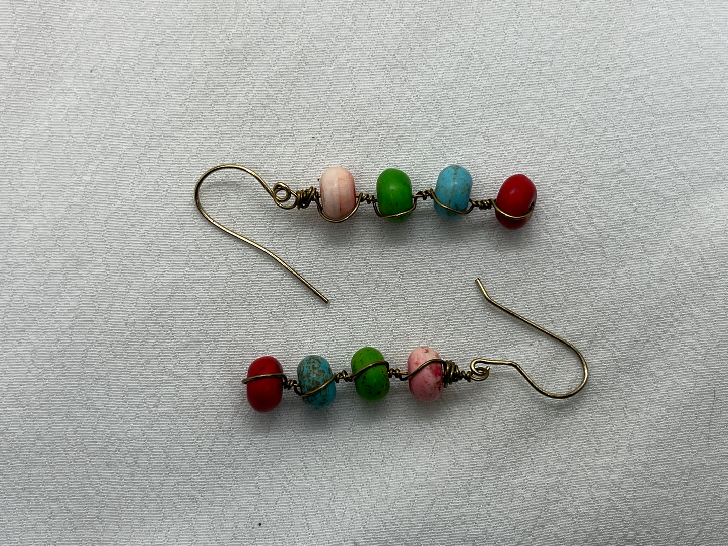 Messing øreringe med 4 på række