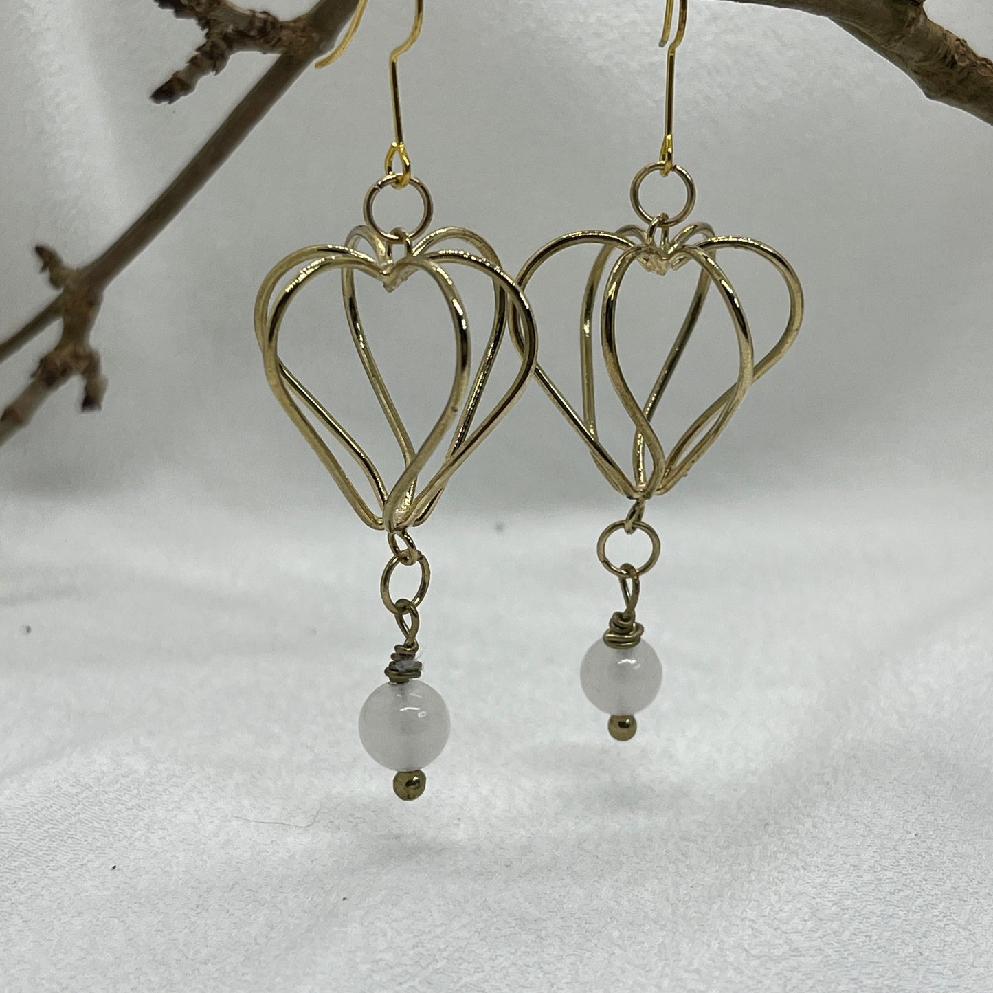 Ørering i messing med hjerteformet vedhæng